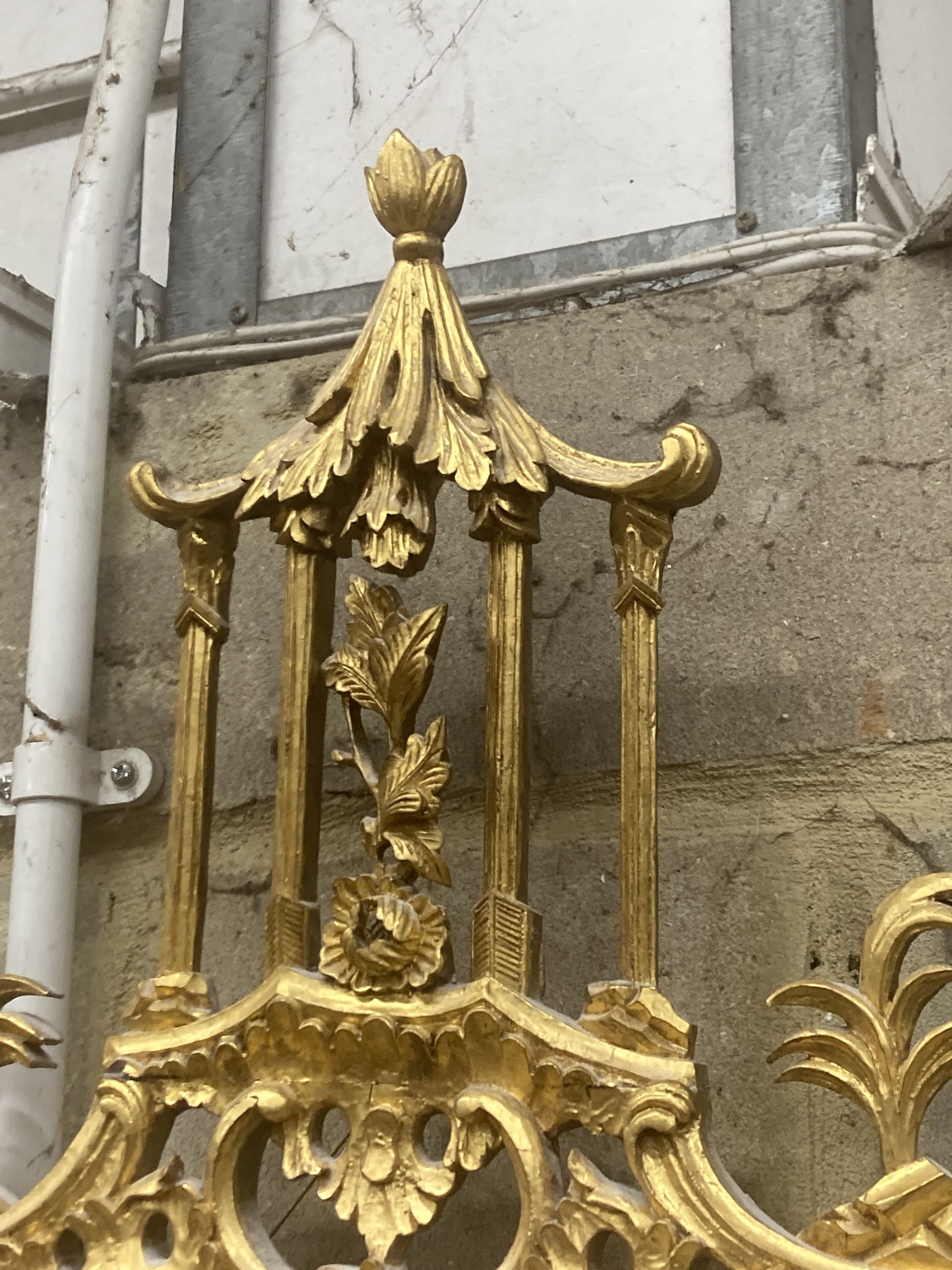 A George III style decorative carved giltwood wall mirror, width 63cm, height 106cm